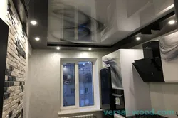 Black glossy stretch ceiling in the kitchen photo