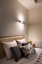 Sconce for a bedroom in a modern style in the interior photo