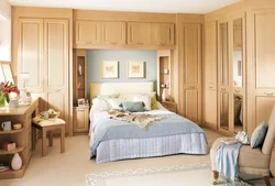 Small bedroom with a large bed and wardrobe photo