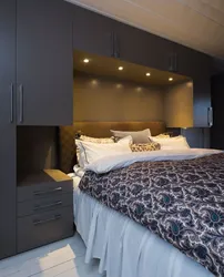 Small bedroom with a large bed and wardrobe photo