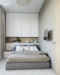 Small bedroom with a large bed and wardrobe photo