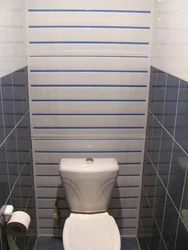 Design of a toilet in an apartment with PVC panels photo