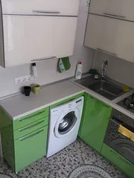 Kitchen in Khrushchev with a water heater and a washing machine photo