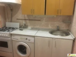 Kitchen In Khrushchev With A Water Heater And A Washing Machine Photo