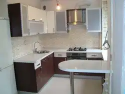 Kitchen 6 sq m with gas water heater and refrigerator photo