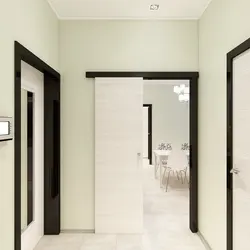 Apartment with dark doors and light floor photo