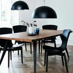 Black chairs in the kitchen interior photo