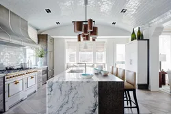 Marble and wood in the kitchen interior photo