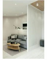 Slatted partition in the living room interior