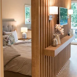 Slatted partition in the living room interior