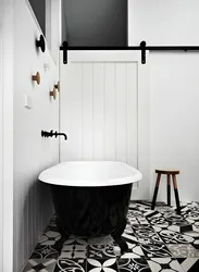 Black floor white walls photo of bathrooms