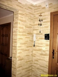 Artificial stone for interior wall decoration in the hallway in the interior