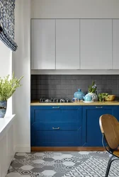 Blue kitchen with wooden countertops in the interior photo