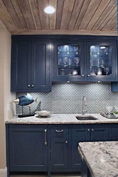 Blue kitchen with wooden countertops in the interior photo