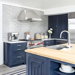 Blue kitchen with wooden countertops in the interior photo