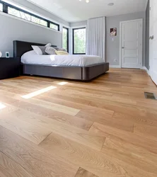 What kind of floors are in the bedroom photo