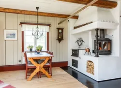 Kitchen with stove in a country house design photo