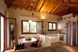 Kitchen with stove in a country house design photo