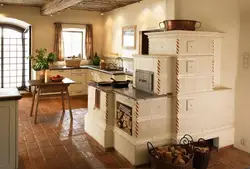 Kitchen with stove in a country house design photo