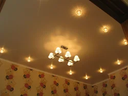 Design Of Lamps On A Suspended Ceiling In The Bedroom