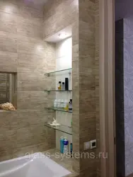 Niche with shelves near the bathtub photo