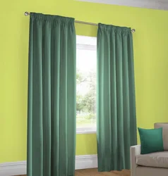 Green curtains in the living room interior