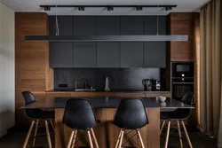 Black kitchen design with wood photo