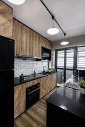 Black kitchen design with wood photo