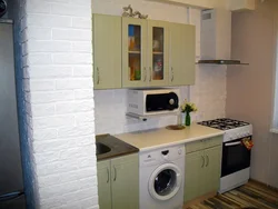 Interior of a small kitchen with a washing machine