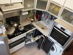 Interior Of A Small Kitchen With A Washing Machine