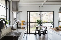 Kitchen in a house with panoramic windows design photo