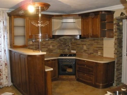 Photo of a kitchen with bar counters all made of wood