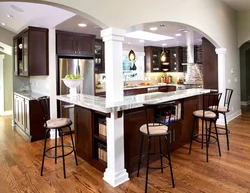 Photo of a kitchen with bar counters all made of wood