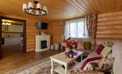 Design of a living room in a country house in a wooden house