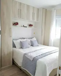 Bedroom design with double bed and wardrobe