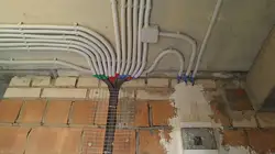 Photo of wiring on the ceiling in the apartment