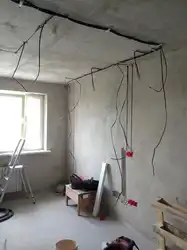 Photo of wiring on the ceiling in the apartment