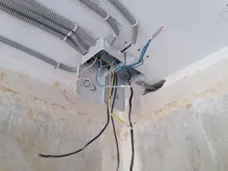 Photo of wiring on the ceiling in the apartment