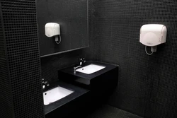 Bathroom with black sink photo