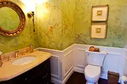 Bathtub with decorative plaster and tiles photo