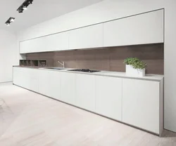 Photo Of A White Kitchen With Wooden Walls