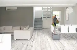 Gray laminate flooring in the living room interior