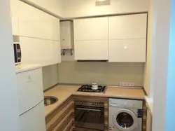 Kitchen with refrigerator and washing machine photo