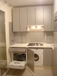 Kitchen with refrigerator and washing machine photo