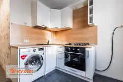 Kitchen With Refrigerator And Washing Machine Photo