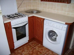 Kitchen with refrigerator and washing machine photo