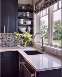 Design of a modern bright kitchen with a window