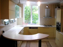 Design of a modern bright kitchen with a window