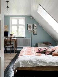 Bedroom design in the attic with a sloping ceiling