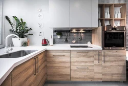 Gray kitchen with a wooden countertop and a wood-effect apron photo